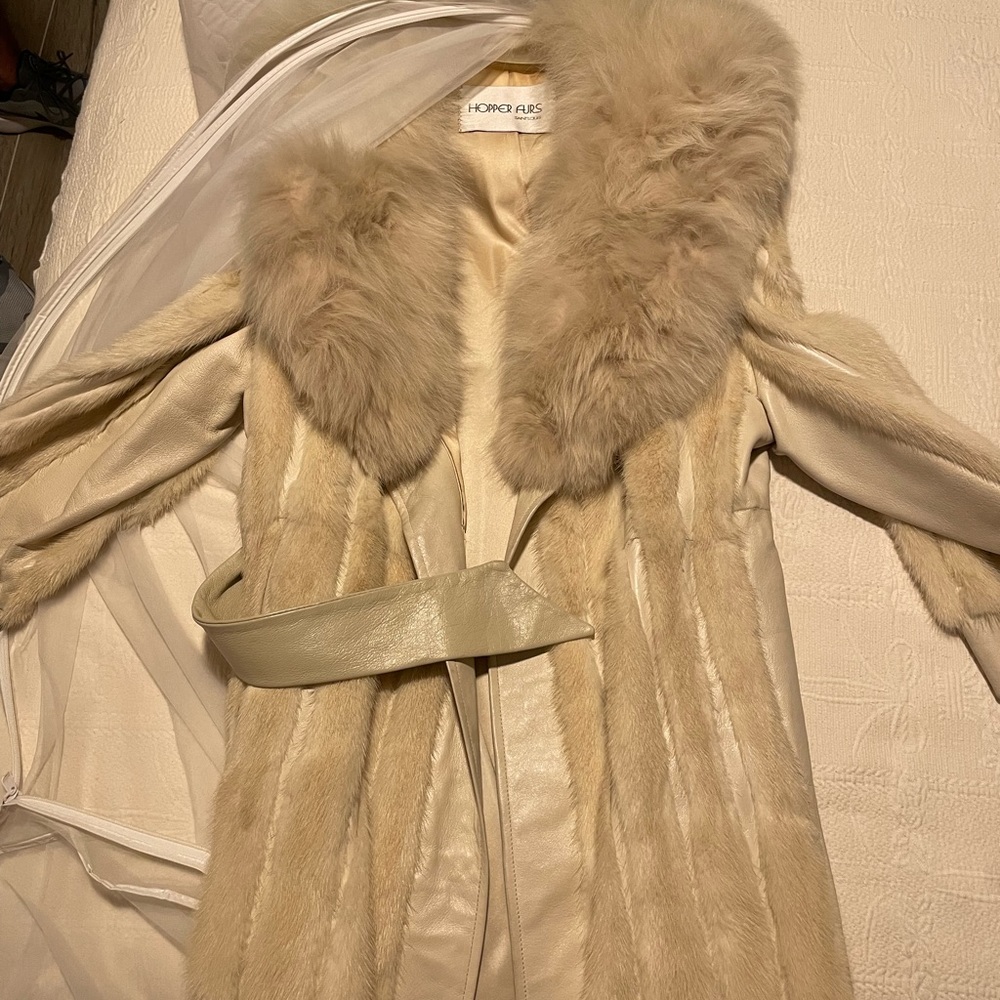 Knee - floor length real mink fur and leather jacket.
